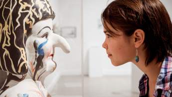 Young girl staring at sculpture, Nanaimo Art Gallery