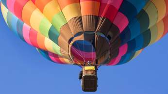 A multicoloured balloon in the sky over Bristol