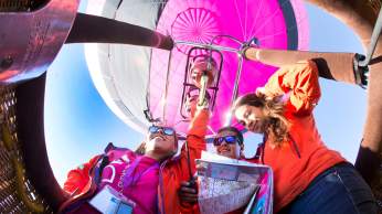 A group of people in a balloon basket at Bristol International Balloon Fiesta - credit Paul Box