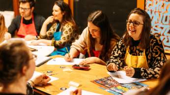 A group of people taking part in one of the street art workshops at Graft Bristol - credit Yuup