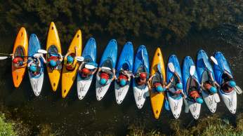 A group of people kayaking at Mendip Activity Centre, near Bristol - credit Mendip Activity Centre