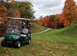 Golf Cart on the course at Autumn Ridge Golf Course with fall foliage