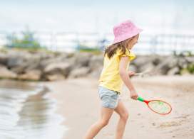 Girl Playing at Lighthouse Park Beach in Manitowoc