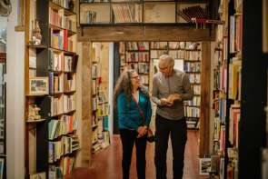 Couple reading book in antique store