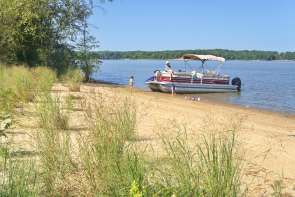Pontoon boat on sand bank