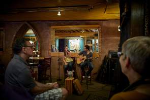 Couple performing live music in bar