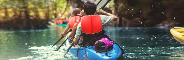 people in a kayak on a river