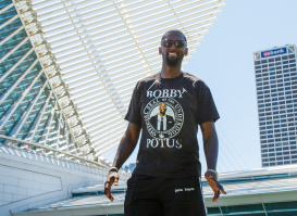 Bobby Portis with the Milwaukee Art Museum in the background with blue skies