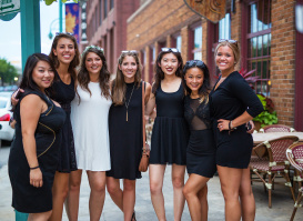 bachelorette party smiling for group photo outside Third Ward