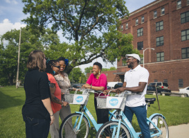 group of friends laughing around bublrr bikes