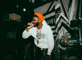 performer singing with mic in hand