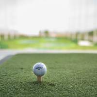 Golf ball sitting on a tee at Top Golf