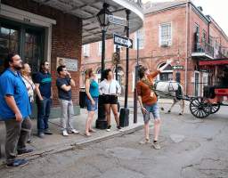 The French Quarter is a must-visit destination for anyone looking to experience the charm and culture of New Orleans. From its vibrant nightlife to its rich history, this iconic neighborhood has something for everyone. Famous for its beads and beers on Bourbon Street, the Vieux Carre's reality far surpasses its Mardi Gras reputation. We’ll show you the real French Quarter beyond Bourbon Street, but we can’t NOT talk about Mardi Gras! Our tour ends at the Presbytere for those who wish to delve deeper into its exhibits for the history and meaning of Mardi Gras and how the city overcame Hurricane Katrina to keep celebrating this centuries-old tradition. Marvel at the stunning architecture of the St. Louis Cathedral, one of the oldest cathedrals in the United States. Wander down Pirate Alley, a narrow way with tales of pirate lore. See homes of literary legends Tennessee Williams and William Faulkner. No tour of the French Quarter would be complete without a stroll down Bourbon Street.