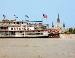 On this Sunday brunch cruise, travel along the Mississippi River while enjoying live jazz music and savoring a lovely buffet brunch, if option selected. Otherwise, sit inside in one of our elegantly appointed decks or sit outside on one of our outdoor decks and enjoy the sites and breezes of the Mississippi River. This authentic paddle-wheel riverboat will whisk you away to the romance and ambiance of yesteryear. The Steamboat NATCHEZ is taking some time off, but her sister vessel, the Riverboat CITY of NEW ORLEANS will be taking her place. You’ll get the same authentic riverboat experience of a leisurely, two-hour cruise on the mighty Mississippi, enjoying traditional live jazz, craft cocktails, and all the beautiful New Orleans sites, while also exploring the newly renovated riverboat. Make sure you check out all four decks - the top deck view is a sight to see! Upgrade your ticket to include the brunch buffet.