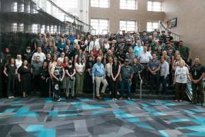 Photo of the Salt Palace Convention Center and Mountain America Expo Center all staff photo on staircase inside the Salt Palace Convention Center.