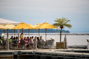 yellow umbrellas and outdoor dining on the edge of Lake Champlain