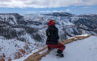 Looking out at the red rock formations of Cedar Breaks National Monument  dusted in snow from the Northern Overlook.
