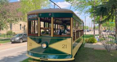 Car 21 going to city park with conductor in driver's seat