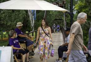 Woman crossing the bridge at Smoky Hill River Festival in Salina Kansas