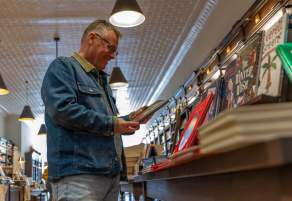 Man looking at book in bookshop