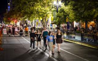 A group walking down Main Street during 2022’s Open Streets.