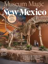 Magazine cover featuring a museum scene with large dinosaur skeleton displays, a painted prehistoric backdrop, and visitors looking up at the exhibit, titled 'Museum Magic New Mexico' for August 2026.