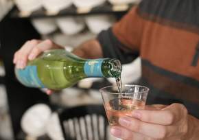 man pouring wine