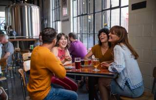 Image of a group of people at Fisher Brewing in SLC