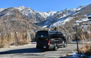 Ski shuttle with snow covered mountains in the background