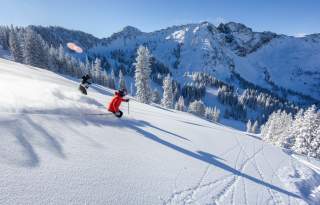 Skiers at Alta Ski Area in winter 2024