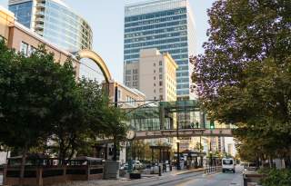 View looking south on main street in Salt Lake in summer time showing the street bridge at City Creek Center