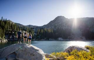 Friends hiking to a lake in Big Cottonwood Canyon