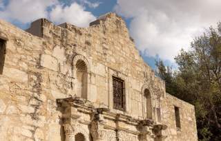 Upper portion of Alamo's facade.