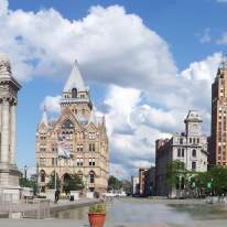 Panorama of Clinton Square with Historic Buidlings and Cloudy Blue Skies