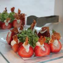 Delicious Bacon and Strawberries Served on a Glass Plate at the Oncenter