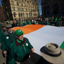 Men in Green Carry Irish Flag Throughout Downtown Syracuse