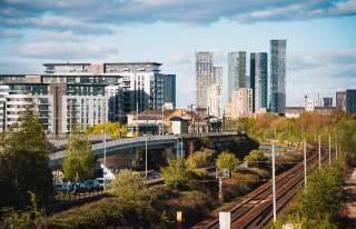 Skyline with train tracks leading into city centre with skyscrapers