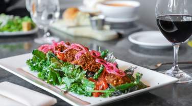 falafel salad and wine from delmonico restaurant in rapid city, sd