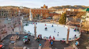 birds eye view of the main street square ice skating rink with skaters in rapid city, sd