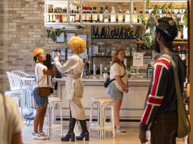 A group of people enjoying Third Ward Gallery Night