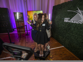 women posing in the photo booth at the annual meeting