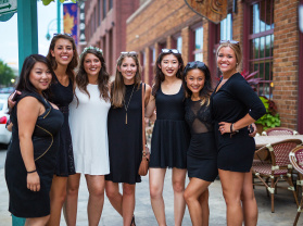 bachelorette party smiling for group photo outside Third Ward
