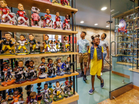 kids and family walking into bobblehead museum