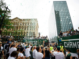 parade floats in the city, confetti in the air