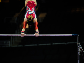 gymnast on the bars at the Fiserv Forum