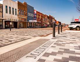 A view of the 400 block of Main Street after the construction fences were taken down. The gray brick with "Main Street" engraved into the concrete is in the foreground with the historic buildings shown in the back.