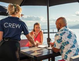 Couple Served Cocktails at Lakeside Dining Patio Eldorado Resort
