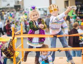 Kids at a Mardi Gras Parade