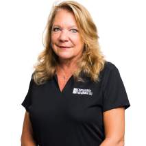 Judie VanPatten Headshot with city background Judie VanPatten Headshot with city background