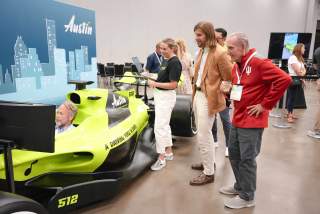 Image of the Austin Sports Commissions F1 Simulator in use at the ASCM Conference.